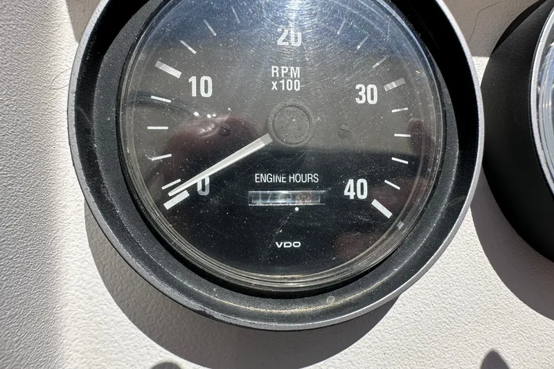 Slide: The Image of Close-up of a Mainship 43 Trawler Aft Cabin tachometer, showing RPM and engine hours. - 33