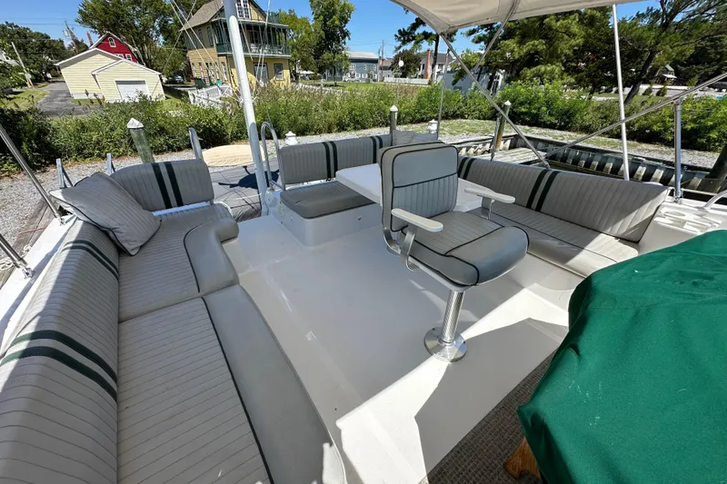 Slide: The Image of 2000 Mainship 43 Trawler Aft Cabin with spacious outdoor seating and helm chair. - 36