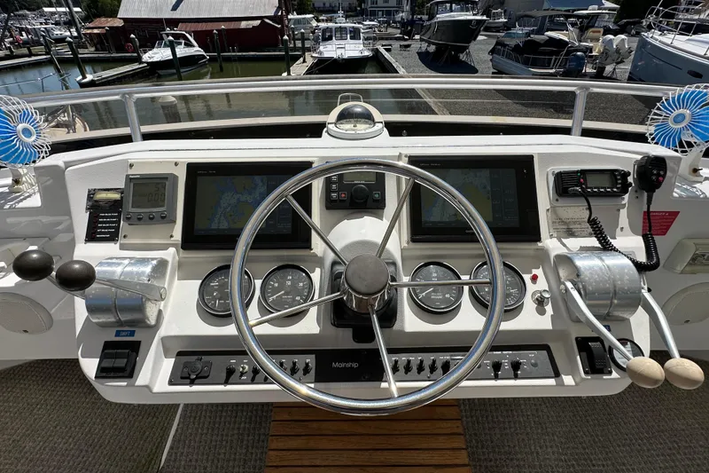 Slide: The Image of Helm of 2000 Mainship 43 Trawler Aft Cabin with navigation instruments and controls. - 8