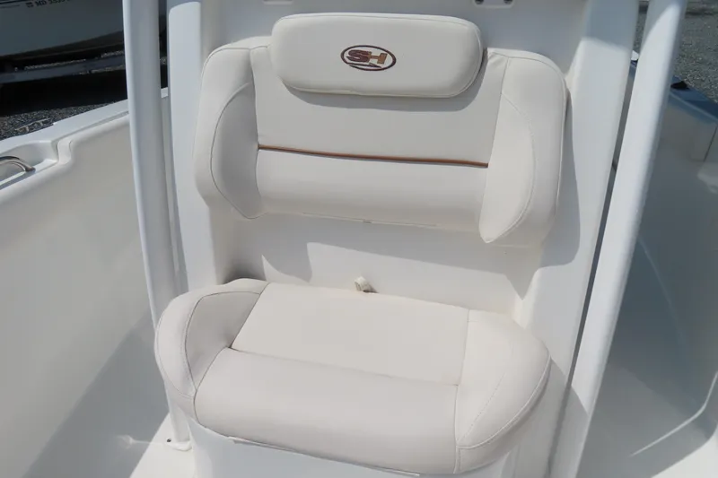 Slide: The Image of 2019 Sea Hunt Ultra 225 boat seat with white cushioned upholstery. - 17
