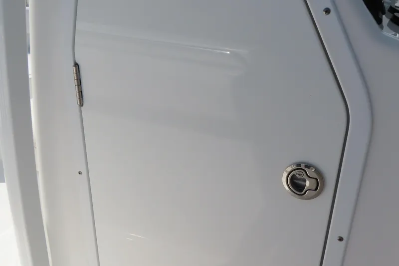 Slide: The Image of 2019 Sea Hunt Ultra 225 boat door with stainless steel latch and hinge. - 19