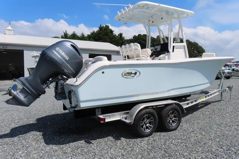 Slide: The Image of 2019 Sea Hunt Ultra 225 boat on trailer with Yamaha outboard motor. - 2