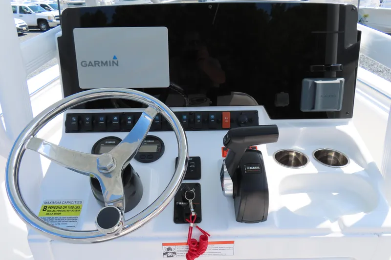 Slide: The Image of 2019 Sea Hunt Ultra 225 boat dashboard with Garmin navigation and Yamaha controls. - 21
