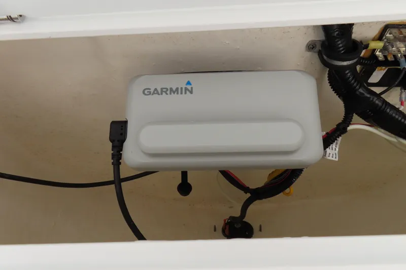 Slide: The Image of Garmin device installed in a 2019 Sea Hunt Ultra 225 boat compartment. - 25