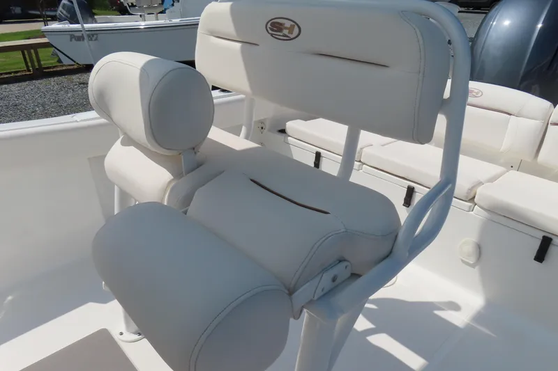 Slide: The Image of 2019 Sea Hunt Ultra 225 boat with white cushioned seating and backrest. - 28