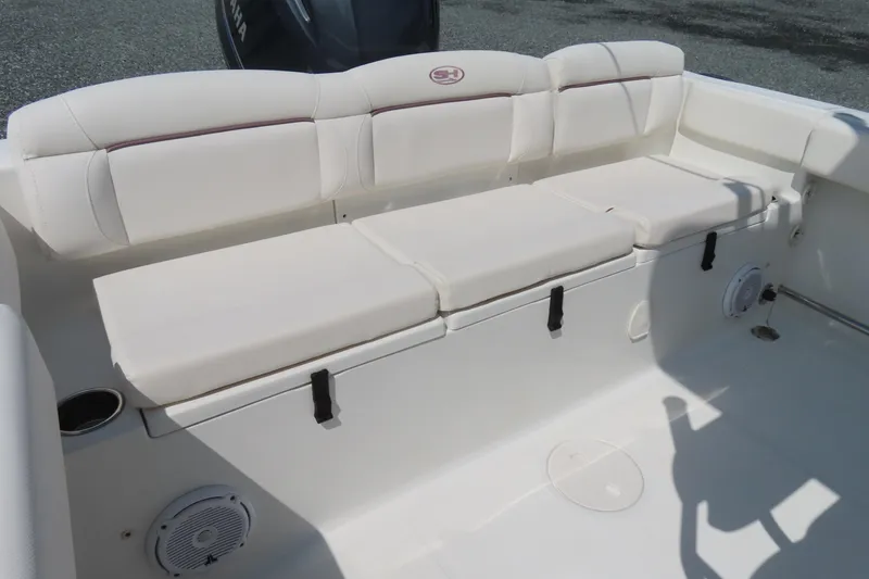 Slide: The Image of 2019 Sea Hunt Ultra 225 boat interior with cushioned seating and storage. - 29