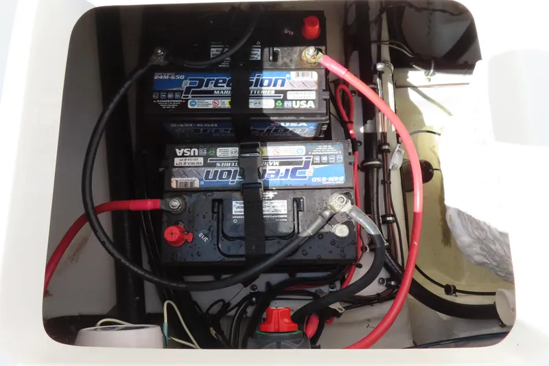 Slide: The Image of Battery compartment of a 2019 Sea Hunt Ultra 225 boat with Precision marine batteries. - 32