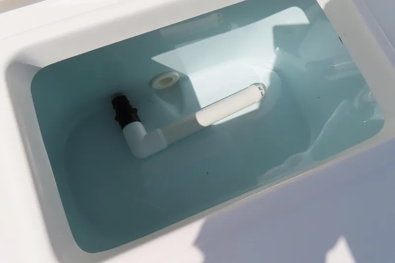 Slide: The Image of Livewell tank in 2019 Sea Hunt Ultra 225 boat, filled with water. - 33