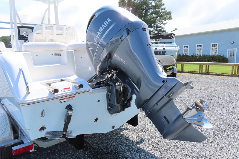 Slide: The Image of 2019 Sea Hunt Ultra 225 boat with Yamaha outboard motor on gravel lot. - 4