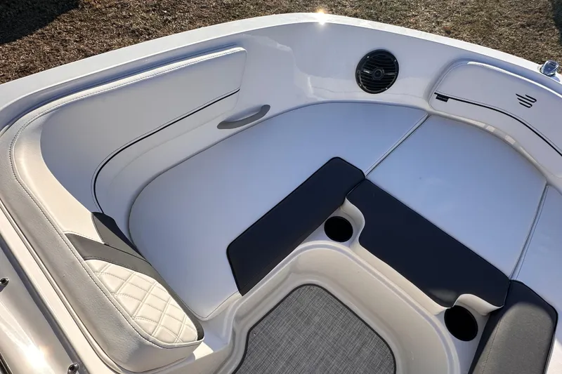 Slide: The Image of 2025 Bayliner VR5 Bowrider OB interior seating with modern design and speaker. - 15