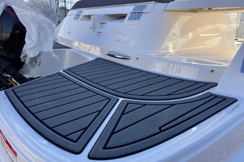 Slide: The Image of 2025 Bayliner VR5 Bowrider OB swim platform with sleek design and modern features. - 3