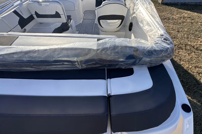 Slide: The Image of 2025 Bayliner VR5 Bowrider OB interior with protective covering, showcasing seating and design. - 4