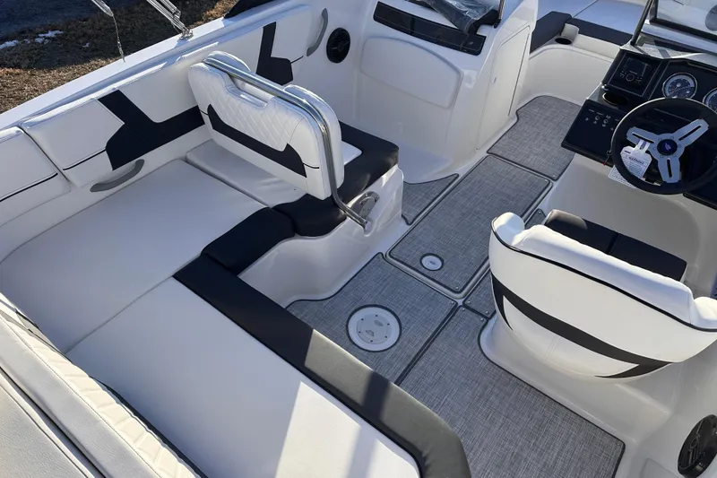 Slide: The Image of 2025 Bayliner VR5 Bowrider OB interior with sleek seating and modern dashboard design. - 6