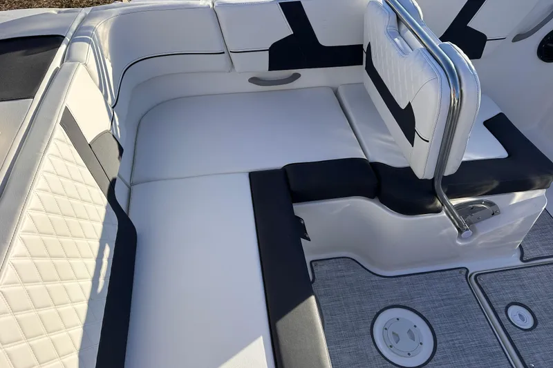 Slide: The Image of 2025 Bayliner VR5 Bowrider OB interior with white and black seating, modern design. - 7