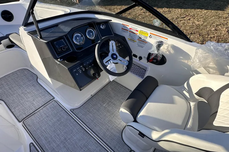 Slide: The Image of 2025 Bayliner VR5 Bowrider OB cockpit with modern steering and dashboard controls. - 9