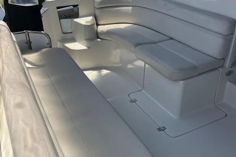 Slide: The Image of Luxurious seating area on a 2000 Regal Commodore 4160 boat, featuring white upholstery. - 14