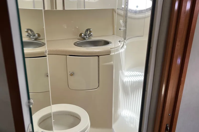 Slide: The Image of Bathroom interior of 2000 Regal Commodore 4160 yacht with dual sinks and toilet. - 23