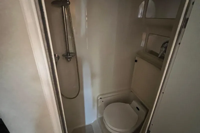 Slide: The Image of Compact bathroom in 2000 Regal Commodore 4160 yacht with shower and toilet. - 25