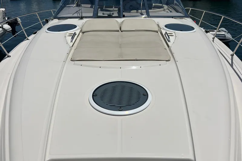 Slide: The Image of 2000 Regal Commodore 4160 yacht deck with sunbathing area and circular hatches. - 3