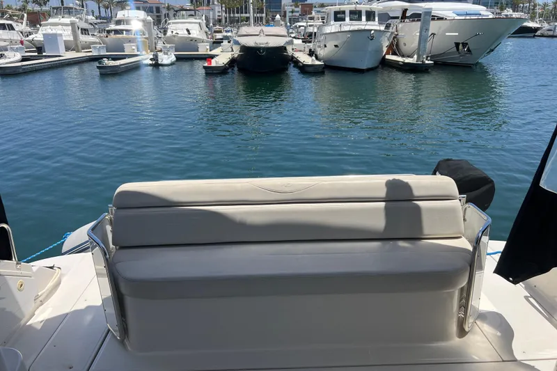 Slide: The Image of Rear view of a 2000 Regal Commodore 4160 yacht docked at a marina. - 8