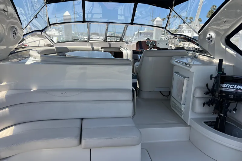 Slide: The Image of Interior of 2000 Regal Commodore 4160 yacht with seating and navigation area. - 9