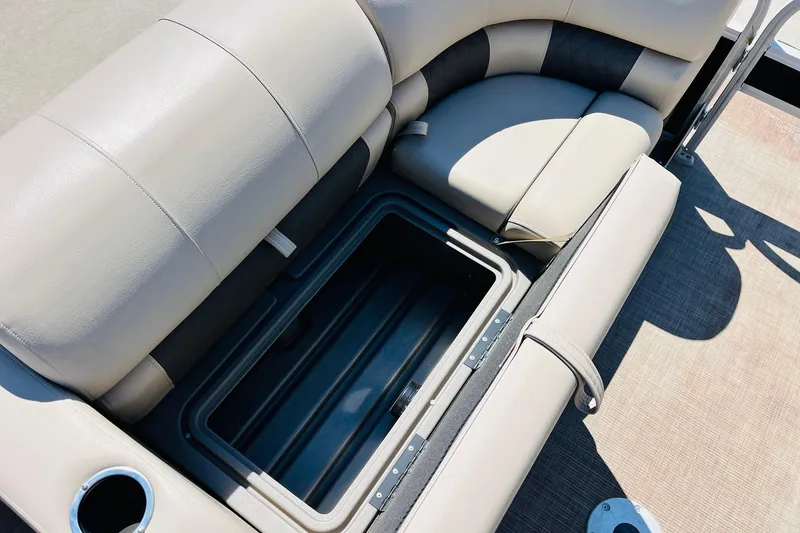Slide: The Image of Sun Tracker SportFish 22 XP3 2022 boat seat with open storage compartment. - 14