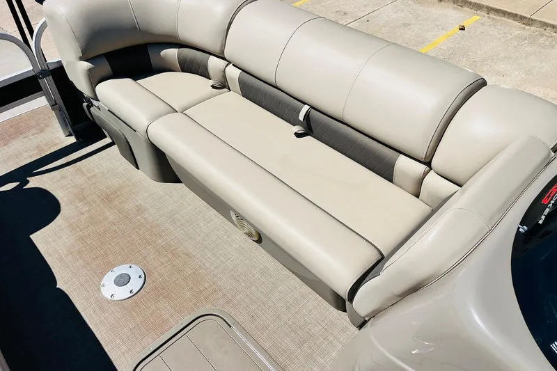 Slide: The Image of 2022 Sun Tracker SportFish 22 XP3 boat interior with beige seating and spacious layout. - 17