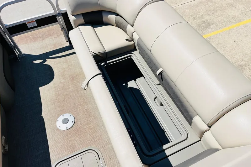 Slide: The Image of Sun Tracker SportFish 22 XP3 2022 boat interior with open storage compartment. - 18