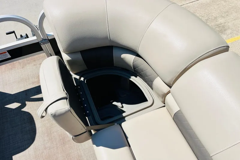 Slide: The Image of 2022 Sun Tracker SportFish 22 XP3 boat seat with storage compartment open. - 19