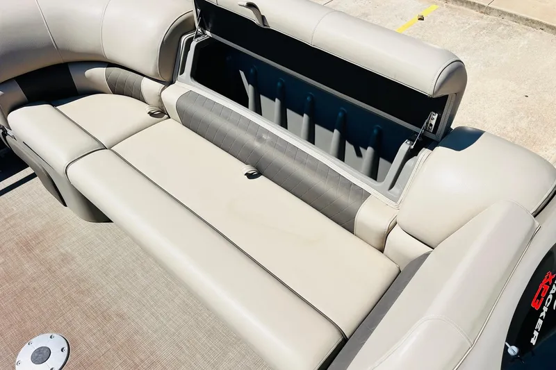 Slide: The Image of 2022 Sun Tracker SportFish 22 XP3 boat interior with open storage compartment. - 20