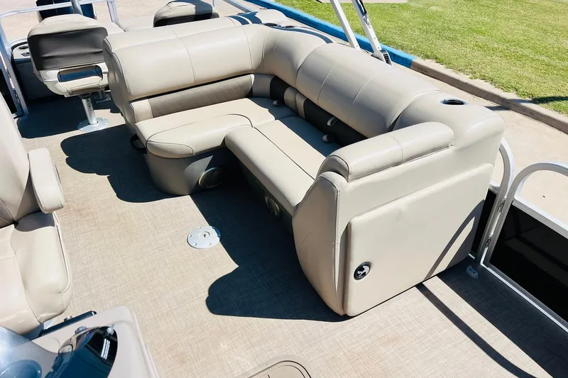 Slide: The Image of 2022 Sun Tracker SportFish 22 XP3 boat interior with beige seating and spacious layout. - 21
