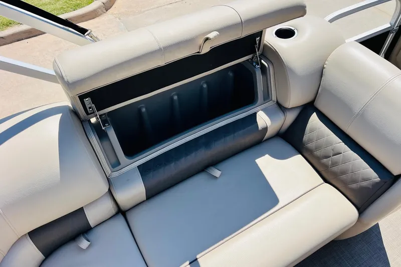 Slide: The Image of 2022 Sun Tracker SportFish 22 XP3 boat seat with storage compartment open. - 27