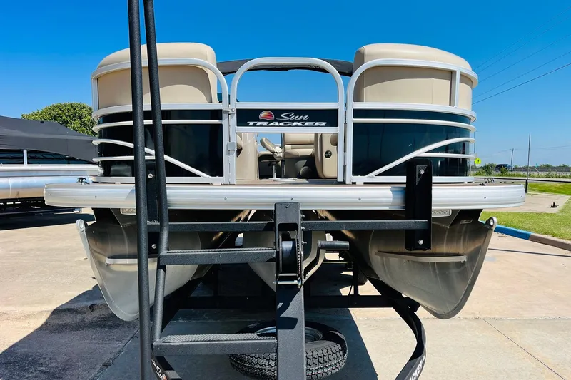 Slide: The Image of 2022 Sun Tracker SportFish 22 XP3 pontoon boat on trailer, sunny day. - 3