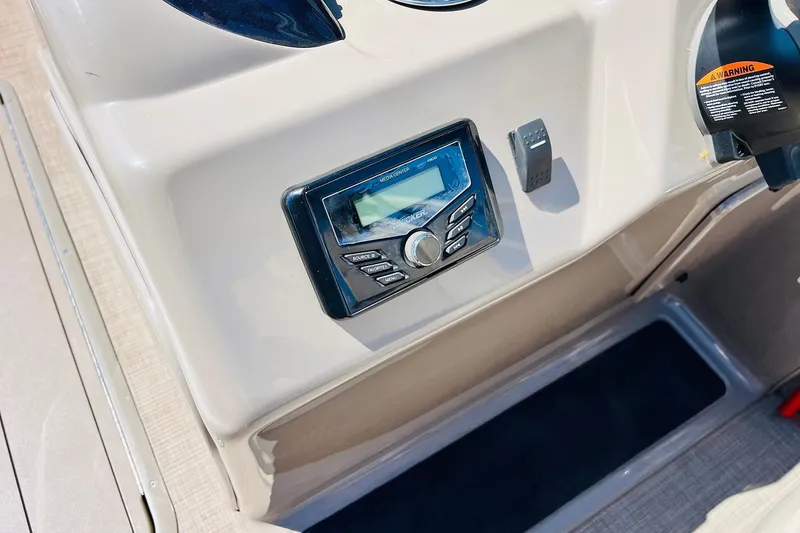 Slide: The Image of Control panel of 2022 Sun Tracker SportFish 22 XP3 boat with audio system. - 30
