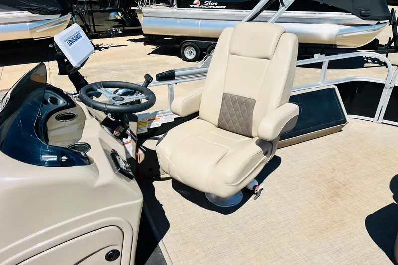Slide: The Image of Captain's chair and helm of 2022 Sun Tracker SportFish 22 XP3 pontoon boat. - 32