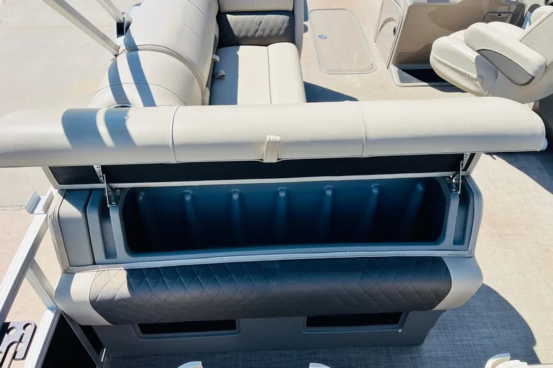 Slide: The Image of 2022 Sun Tracker SportFish 22 XP3 boat interior with open storage compartment. - 39