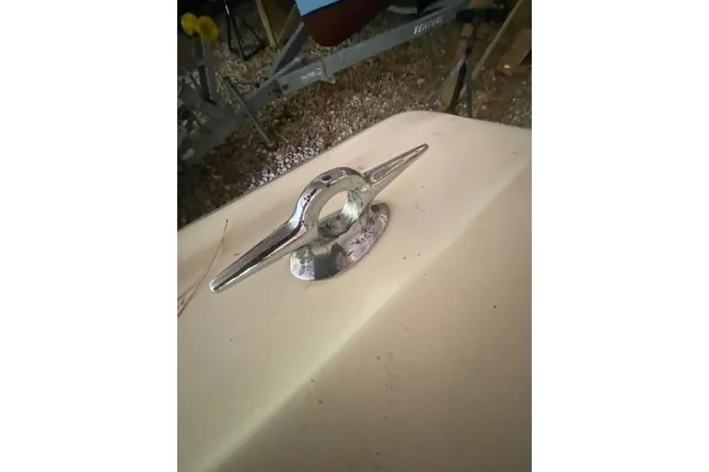 Slide: The Image of 1968 HILINER Sportsman boat cleat on deck, showcasing vintage nautical hardware. - 14