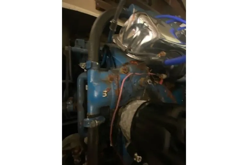 Slide: The Image of 1968 HILINER Sportsman engine with blue components and visible wiring. - 16