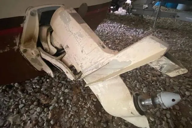 Slide: The Image of 1968 HILINER Sportsman boat outboard motor on gravel surface. - 18