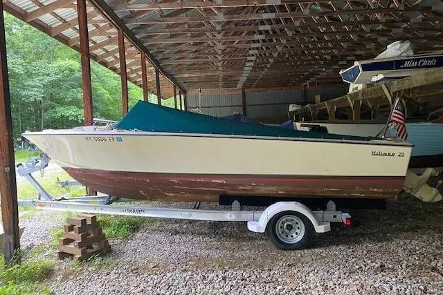 Slide: The Image of 1968 HILINER Sportsman boat on trailer in covered storage area. - 3