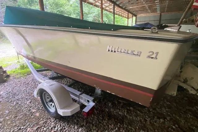 Slide: The Image of 1968 HILINER Sportsman boat on trailer under a shelter, side view. - 4