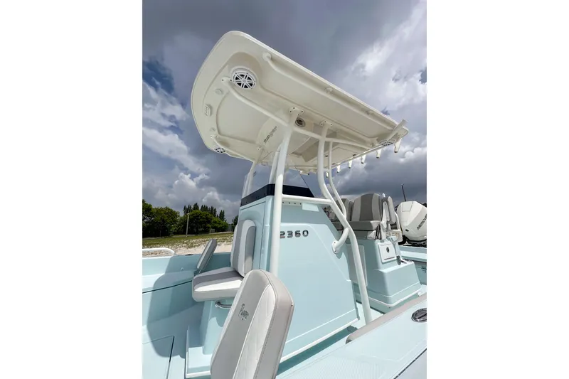 Slide: The Image of 2025 Ranger 2360 Bay boat with T-top under cloudy sky. - 4