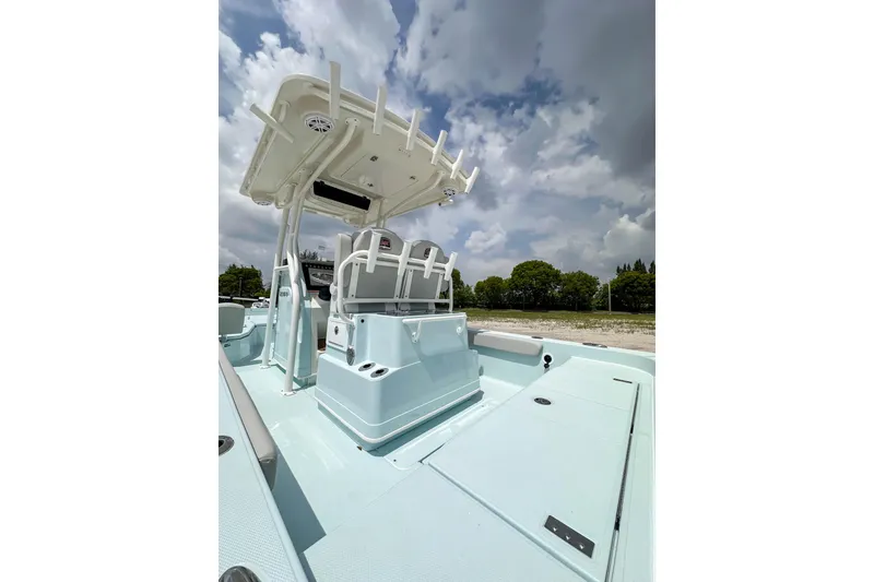 Slide: The Image of 2025 Ranger 2360 Bay boat with T-top under cloudy sky. - 6