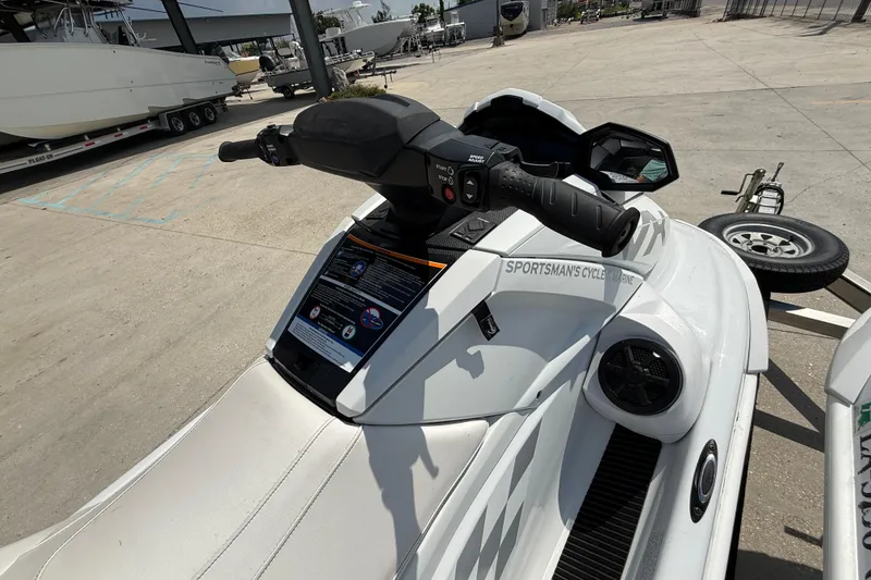 Slide: The Image of 2023 Yamaha WaveRunner VX Cruiser HO parked at a marina, showcasing handlebars and seat. - 11