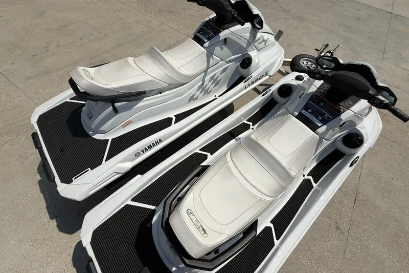 Slide: The Image of 2023 Yamaha WaveRunner VX Cruiser HO jet skis on concrete surface, top view. - 8