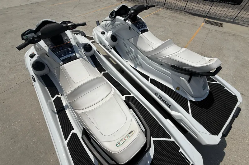 Slide: The Image of 2023 Yamaha WaveRunner VX Cruiser HO jet skis parked on concrete surface. - 9