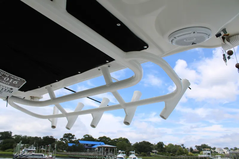 Slide: The Image of Boston Whaler 320 Outrage 2015 boat rod holders and speaker under blue sky. - 30