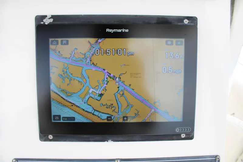 Slide: The Image of Raymarine navigation display on 2015 Boston Whaler 320 Outrage, showing map and speed data. - 35