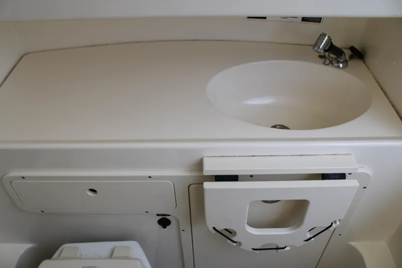 Slide: The Image of Interior sink area of a 2015 Boston Whaler 320 Outrage boat. - 41