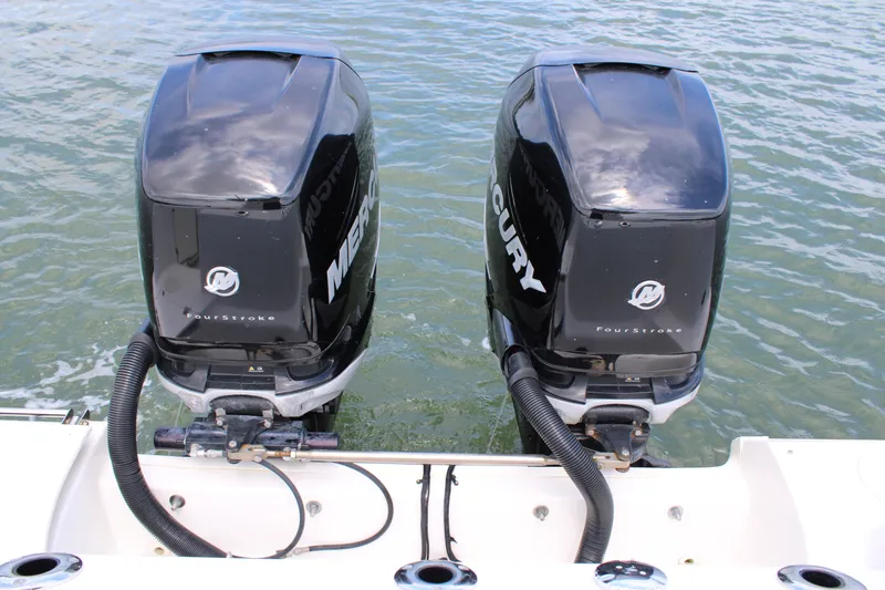 Slide: The Image of Twin Mercury FourStroke engines on a 2015 Boston Whaler 320 Outrage boat. - 69